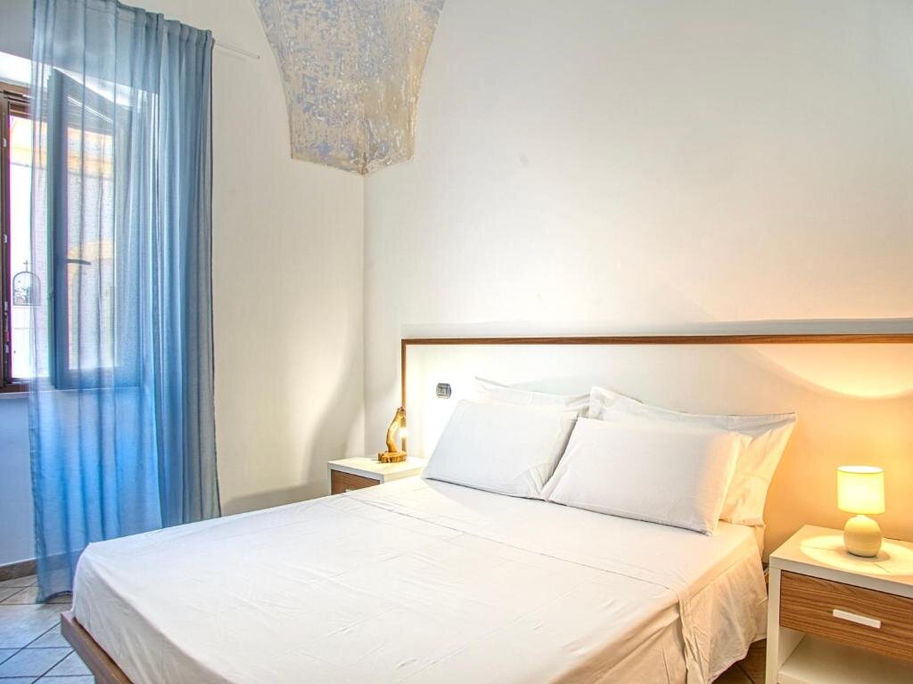 Camera Queen con Vista Giardino - Ideal Rooms Porto Cesareo